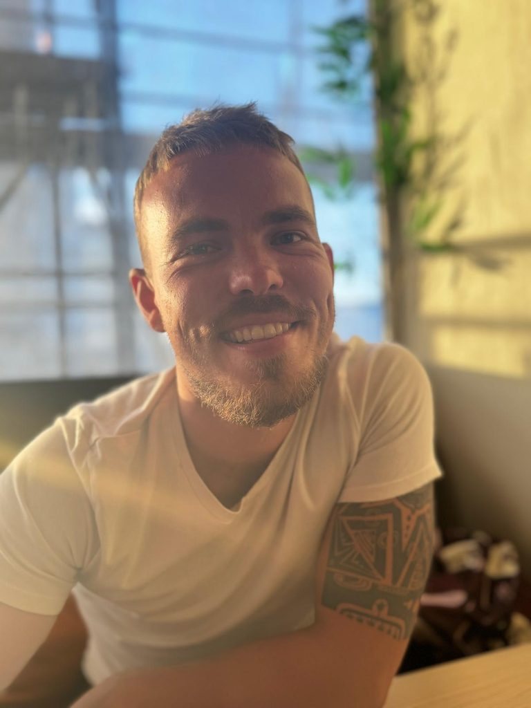 Rasmus Anton smiling in warm sunlight